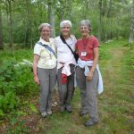 3 pals wearing similar pants on roadway